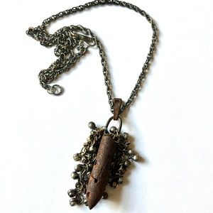 Antique repurposed (sewing machine) bobbin pendent necklace.